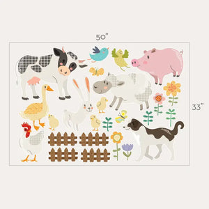 A young child reaches up towards a blue bird decal on a white wall decorated with SIMPLE SHAPES - FARM ANIMALS REMOVABLE WALL DECALS. The wall showcases decals of a cow, sheep, duck, rabbit, pig, dog, and chicken, along with flowers and butterflies from the SIMPLE SHAPES brand, creating a playful farm scene.