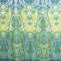 The KINROSS CASHMERE - FADED PAISLEY CASHMERE SILK SCARF by KINROSS showcases an intricate, symmetrical pattern featuring a blend of green and yellow hues on a blue-toned background. The design, reminiscent of ornate, floral, and paisley-like motifs, creates a visually rich tapestry-like appearance that evokes the luxurious feel of woven silk and cashmere.