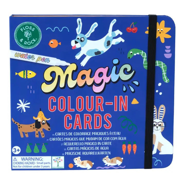An open children&#39;s activity book by FLOSS &amp; ROCK, the &quot;PETS WATER PEN AND CARDS,&quot; features colorful sections labeled &quot;Words,&quot; &quot;Numbers,&quot; and &quot;Scenes.&quot; Included are drawing examples, a blank coloring page, and a closed pouch labeled &quot;Magic Colour-in Cards&quot; containing a marker pen. This eco-friendly coloring book showcases travel-friendly toys in vibrant orange, blue, and white.
