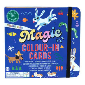 An open children's activity book by FLOSS & ROCK, the "PETS WATER PEN AND CARDS," features colorful sections labeled "Words," "Numbers," and "Scenes." Included are drawing examples, a blank coloring page, and a closed pouch labeled "Magic Colour-in Cards" containing a marker pen. This eco-friendly coloring book showcases travel-friendly toys in vibrant orange, blue, and white.