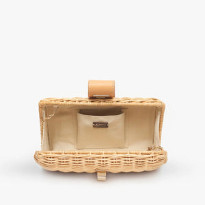 The KAYU - LOU CLUTCH is a rectangular wicker clutch in light tan with a chic tan leather flap and gold-tone turn lock closure, set beautifully against a plain white background. Ideal for any occasion.