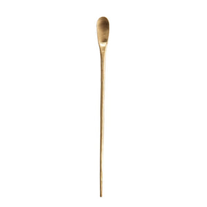 The Creative Coop Brass Cocktail Spoon features a sleek and elegant design with a long, thin profile. It boasts a narrow, elongated bowl and a slim, straight handle. This brass utensil has a shiny, polished surface that exudes sophistication and style.