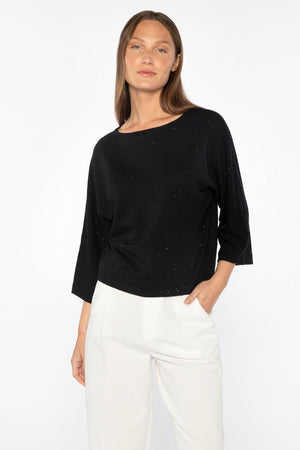 The KINROSS CASHMERE - SEQUIN EASY CROP PULLOVER by KINROSS features a light beige knit with subtle silver threads for an elegant, versatile shimmer, embodying sophisticated casual wear with its modern chic design and detailed pattern.