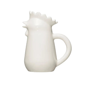 A STONEWARE CHICKEN CREAMER by CREATIVE COOP sits on a small, rustic wooden box against a gray background. Its wavy, crown-like rim is showcased beautifully, making it the perfect addition to any elegant home collection.