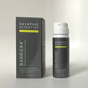 A can and box of BAREFOOT SCIENTIST - BLISTER PREVENTION SPRAY, both gray with yellow accents, are displayed on a plain light background. The packaging highlights its friction barrier formula for effective blister prevention and irritation relief.