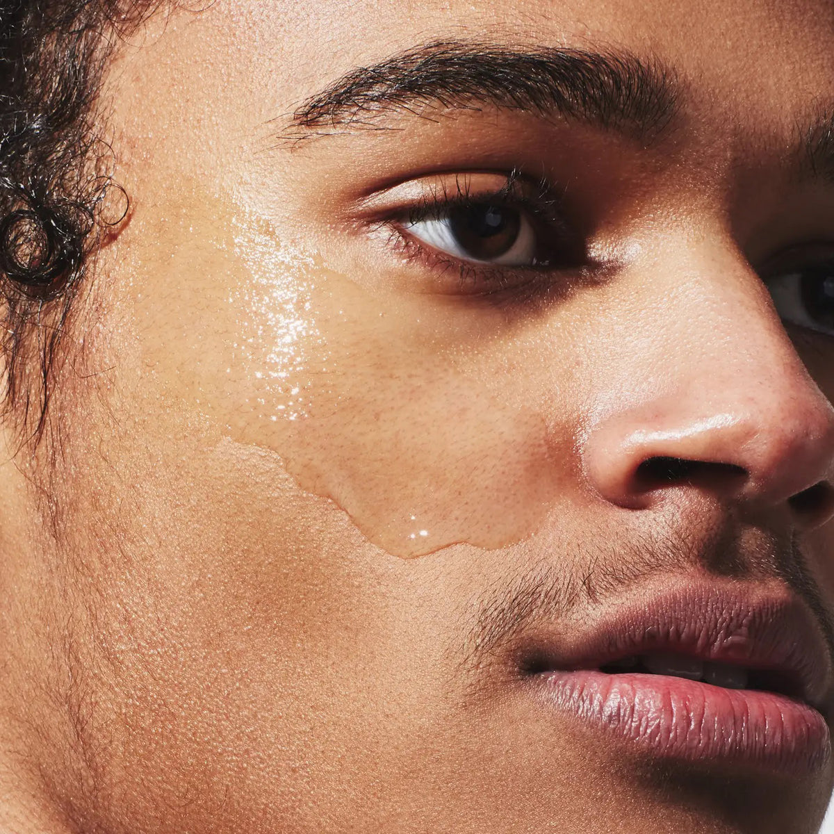 A white bottle labeled &quot;JAXON LANE - SUPER SERUM ULTRA LUMINOUS FACE SERUM FOR MEN,&quot; 1 fl oz / 30 ml, with a white cap stands upright on a plain white background—ideal for men seeking a brightening serum with niacinamide.