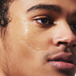 A white bottle labeled "JAXON LANE - SUPER SERUM ULTRA LUMINOUS FACE SERUM FOR MEN," 1 fl oz / 30 ml, with a white cap stands upright on a plain white background—ideal for men seeking a brightening serum with niacinamide.