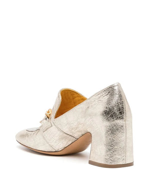 The LEATHER MID HEEL LOAFER WITH CHAIN by MADISON MAISON is a luxurious mid heel loafer crafted in metallic silver leather, showcasing a square toe and an elegant gold chain detail across the top. Featuring a medium height, the handmade Italian craftsmanship is evident in its subtle textured finish.