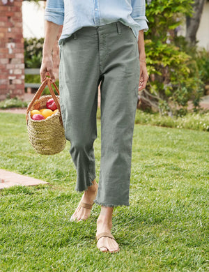 A pair of FRANK & EILEEN - KINSALE TROUSER IN PERFORMANCE LINEN in olive green, displayed against a plain white background. These straight-cut women’s pants feature a high-rise waistband, raw edge hem, and belt loops, and are made of lightweight fabric.