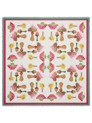 The FRANCO FERRARI DILETTO COTTON SILK SCARF 135CM is a colorful square scarf that features a symmetrical design with vibrant patterns. The central motif includes rockets and futuristic elements on a green and yellow diamond-patterned background. Surrounding it are hearts, stars, and flames in bold reds, blues, and yellows. Crafted in Italy from luxurious silk and cotton blend, the edges are fringed for an added touch of elegance.
