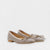 A pair of MICHELE LOPRIORE - MIA BALLET FLAT shoes by MICHELE LOPRIORE, featuring glittery silver leather with small bows on the front, displayed against a plain white background. Made in Italy, these shoes boast a low heel and a sleek, shiny texture.