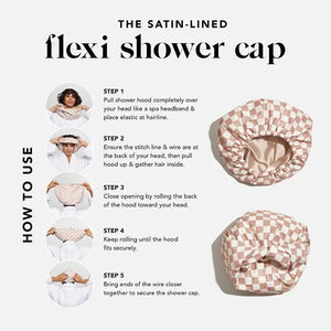 Displayed is the SATIN LINED FLEXI SHOWER CAP by KITSCH, featuring a white and brown checkerboard pattern. This cap boasts a waterproof shell and satin lining, suitable for fine, curly, or straight hair. The product packaging, which matches the cap's design, sits alongside it and showcases a photo of someone wearing the cap with an adjustable back wire closure.