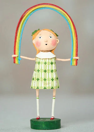 The ESC AND COMPANY - RAINBOW BRIGHT FIGURINE by ESC AND COMPANY, INC features a poly resin girl with orange hair in a green and white clover dress, holding a rainbow on a 7" green base.