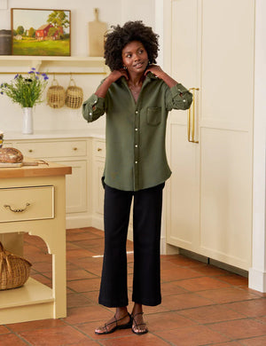 The FRANK & EILEEN Eileen Relaxed Button Up in Triple Fleece Caper is an olive green long-sleeve shirt with a single chest pocket and rolled-up sleeves, shown on a white background.