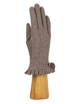 A green, wool knit glove from Santacana Madrid World Glove Company is showcased upright on a wooden hand-shaped stand, featuring a simple pleated trim around the wrist.