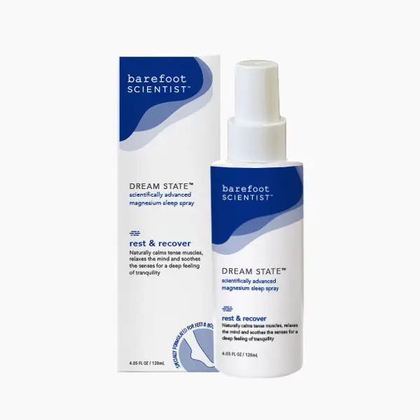 A bottle and box of BAREFOOT SCIENTIST - DREAM STATE MAGNESIUM SLEEP SPRAY, labeled &quot;rest &amp; recover,&quot; soothe muscles and support sleep with magnesium and ashwagandha. Both feature a calming blue and white design.