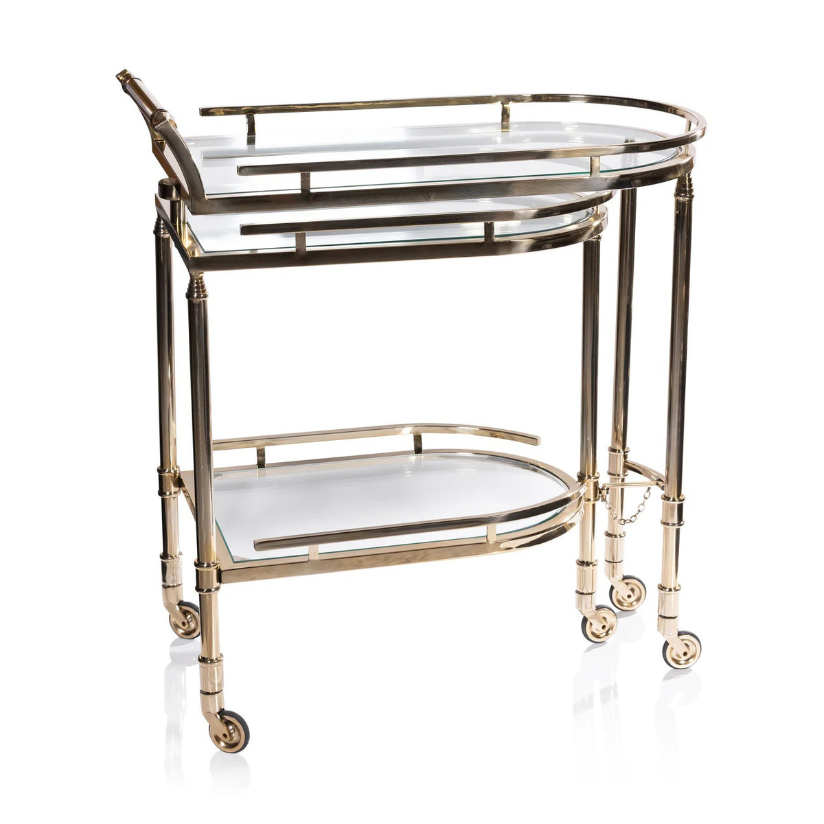 The SPIGA GOLD BAR CART by ZODAX features a gold alloy glass frame, two glass shelves, and four small wheels for easy mobility and stylish serving.