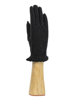 A green, wool knit glove from Santacana Madrid World Glove Company is showcased upright on a wooden hand-shaped stand, featuring a simple pleated trim around the wrist.