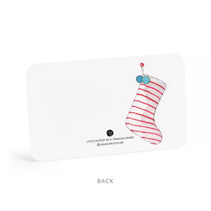 A SANTA LITTLE NOTES gift card from E.FRANCES PAPER showcasing a delightful watercolor painting of Santa Claus wearing his red hat against a light blue background. The left side of his face is featured, highlighting his white beard and rosy cheeks. The word "Front" is elegantly inscribed below the card.