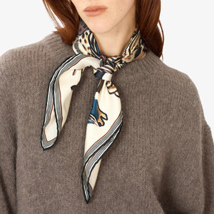 The INOUI EDITIONS - WESTERN SQUARE SILK SCARF by INOUI showcases a vibrant, detailed illustration of horses in dynamic poses. Each horse is adorned with distinct patterns like spots, stripes, and swirls that evoke the elegance of silk fabric designs. Set against a plain background, this versatile piece of art is signed at the bottom.