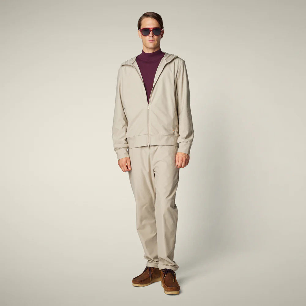 SAVE THE DUCK - MICHAEL MEN&#39;S TECH TROUSERS: Beige straight-leg men’s pants from SAVE THE DUCK, featuring an elastic waistband and crease-resistant stretch fabric, shown on a plain light background.