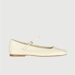 The AUGUSTA - JULIETA MARY JANE by AUGUSTA is a black leather flat shoe featuring a slender, adjustable strap across the top and a low wooden heel. With its renewed silhouette, slightly pointed toe, and minimalist design, this handcrafted Spanish shoe is presented against a plain, light gray background.