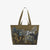 The INOUI EDITIONS MAXI WESTERN SHOPPER BAG by INOUI is a brown tote bag adorned with a design showcasing multiple horses in various poses, painted in shades of brown, black, and white with intricate detailing. Made from recycled polyester, this eco-friendly bag features two shoulder straps and a smaller pair of handles for versatile carrying options.