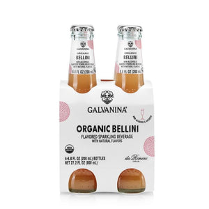 Image of a 4-pack of GALVANINA - BELLINI MOCKTAIL sparkling beverages from INTERNATIONAL GOURMET FOODS. Each clear glass bottle contains 6.8 fl oz (200 ml) of drink made with organic peach juice, showcasing a delicate peach-colored liquid inside. The packaging is white with pink accents and labeled "Organic Bellini.