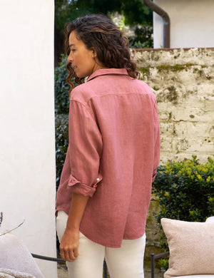 The FRANK & EILEEN Eileen Relaxed Button-Up Shirt in Mauve Washed Linen is a long-sleeved button-up shirt featuring a collar and a single chest pocket. The washed linen fabric provides a slightly textured appearance, with the sleeves casually rolled up for a laid-back style. This relaxed fit shirt is showcased against a plain white background.

