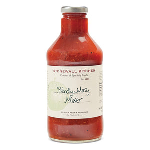 A bottle of STONEWALL KITCHEN - BLOODY MARY MIXER is displayed with a silver cap and a white label featuring green text. This gourmet mixer is gluten-free and non-GMO, containing 24 fluid ounces (710 milliliters) of product—perfect for your next brunch gathering.