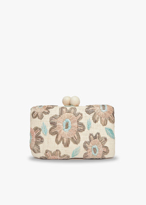 The KAYU - BRYN CLUTCH from KAYU is a rectangular fabric clutch with beige and blue floral patterns on a cream background. It features an elegant clasp made of two beige spherical knobs, adding charm reminiscent of a wooden ball clasp.