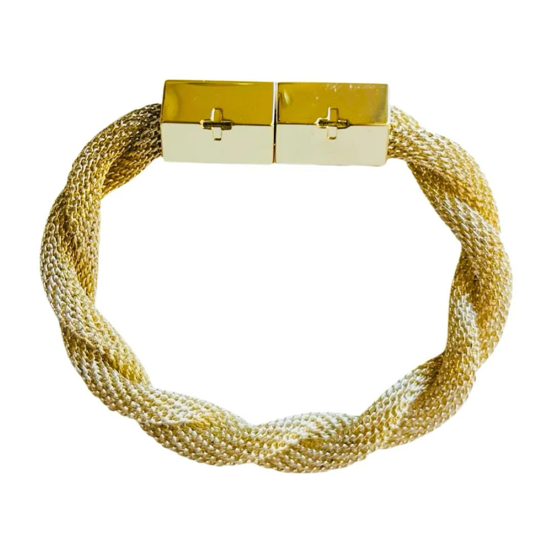 The HOLST & LEE - TWISTED MESH BRACELET by HOLST & LEE is a gold-colored accessory featuring a shiny, rectangular signature magnetic clasp adorned with two cross-shaped embellishments, adding a touch of elegance to its twisted mesh design.