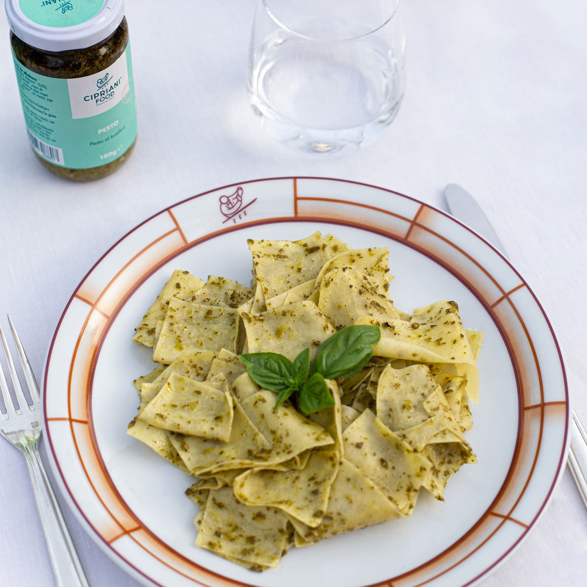A light turquoise package of Cipriani - Organic Tagliardi Egg Pasta from Atalanta Corporation, weighing 250 grams (8.8 ounces), is displayed. The box features a clear window revealing the extra thin Durum wheat egg pasta inside, with text highlighting its GMO-free quality and that it&#39;s proudly made in Italy.