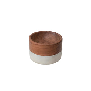 The MARBLE AND ACACIA PINCH POT by CREATIVE COOP is a small, round bowl combining acacia wood and ceramic. It features a sleek brown finish on the top half and white ceramic on the lower half, offering a simple yet contemporary design reminiscent of a modern pinch pot.