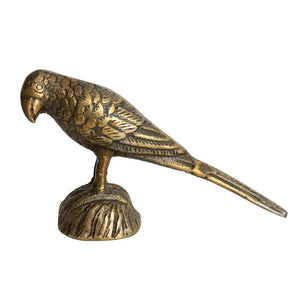 A small CAST ALUMINUM BIRD by CREATIVE COOP, featuring meticulously detailed feathers, stands atop a stack of closed books against a plain white background. Ideal for interior design enthusiasts, the bird is perched on a textured base with its tail extended horizontally.