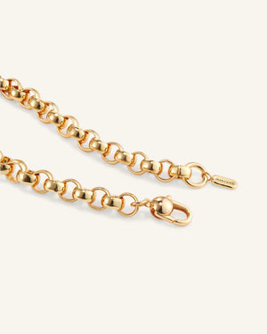 The JENNYBIRD RODIN NECKLACE is a high-polish gold rolo chain with interlocking round links arranged in an elegant circular pattern, beautifully showcased on a light background.