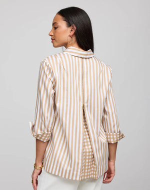 A woman with long dark hair stands with her back to the camera, highlighting a classic look: the HINSON WU Wena 3/4 Sleeve Top in Stripe Gingham Combo, featuring rolled-up sleeves and a visible back zipper. She complements this with hoop earrings and bracelets, paired perfectly with crisp white pants.