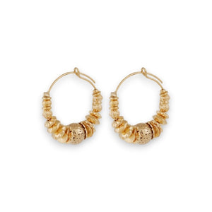 The GAS BIJOUX - ALOHA HOOP EARRING features gold-plated hoops adorned with multiple textured gold beads. Each hoop showcases a central large decorative bead flanked by smaller, intricately designed beads, creating an elegant and intricate appearance. These haute-fantaisie jewelry pieces from Gas Bijoux are set against a white background.