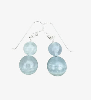 ANN LIGHTFOOT DOUBLE DROP BLUE CALCITE EARRINGS: Two round, translucent light blue calcite beads stacked vertically on each sterling silver hook, shown against a white background.