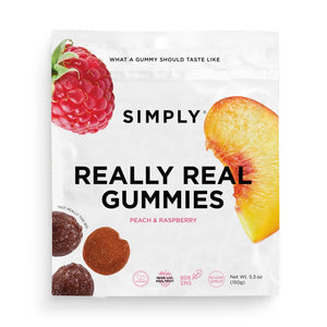 A white package of SIMPLY GUM - REALLY REAL PEACH RASPBERRY GUMMIES 5.3OZ featuring a raspberry and peach slice. Icons highlight that it's free of artificial flavors, made with high quality ingredients, no corn syrup, non-GMO, and vegan. Perfect for satisfying your gummy cravings with real fruit. Net weight is 5.3 oz.
