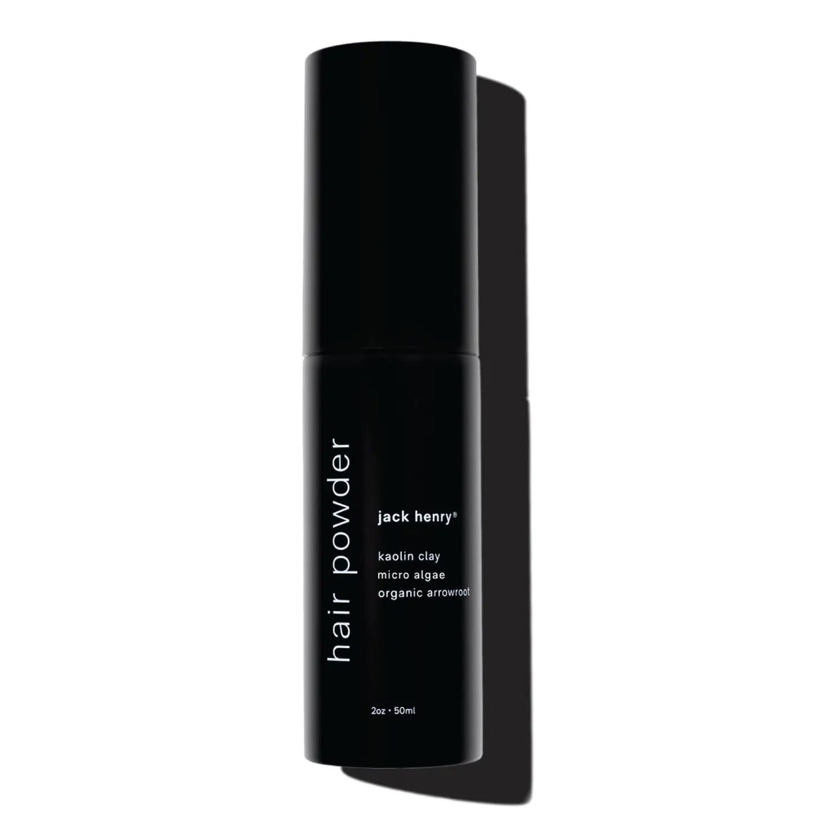 A shirtless person holds a black JACK HENRY – HAIR POWDER bottle, a dry shampoo with smectite, micro algae for growth and shine, and arrowroot to absorb oil—leaving hair clean and matte.