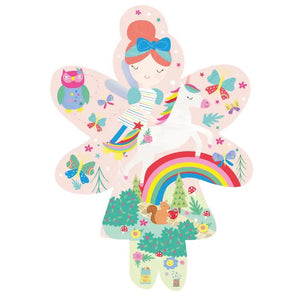 A vibrant, fairy-shaped box contains the 20-piece "FLOSS AND ROCK - RAINBOW FAIRY JIGSAW PUZZLE." This puzzle by Floss & Rock features a whimsical design with a fairy holding a rainbow, surrounded by flowers, mushrooms, unicorns, a smiling sun, and various playful elements. The brightly colored pieces make it an ideal choice for children ages 3 and up.