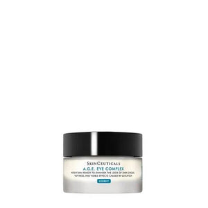 A jar of SKINCEUTICALS - A.G.E EYE COMPLEX, an anti-wrinkle eye cream by Skin Ceuticals designed to improve the appearance of dark circles, puffiness, and visible effects of aging around the eyes. The jar features a black lid and a light label with product information written on it.