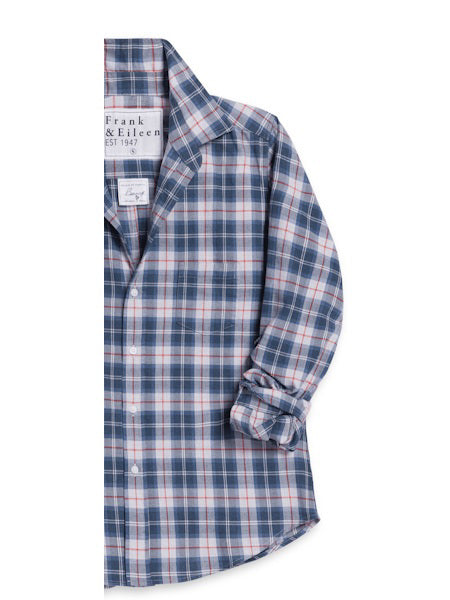 The FRANK &amp; EILEEN Finbar men&#39;s button-up shirt in Italian flannel features a grey and red plaid pattern, long sleeves (one partly rolled), and a chest pocket. Shirt is laid flat, collar and pocket visible; left side cut off vertically.