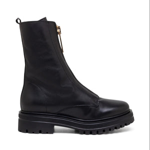 The MICHELE LOPRIORE MINSK Boot with Fur is a sleek black combat boot made of genuine leather featuring a front zipper closure and a chunky sole. The boot boasts a slightly rounded toe and includes a pull tab at the back for ease of wearing. Made in Italy, the sole has deep treads for enhanced grip and durability.