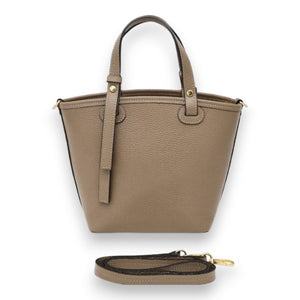 The LISA LIVI LEATHER HANDBAG WITH CROSSBODY STRAP is a taupe-colored, textured leather handbag with two short handles and a flap closure. Made in Italy, the bag measures 29x22x12 cm and features gold-toned hardware with a sleek, minimalist design. It includes an adjustable, detachable shoulder strap placed below the bag. The background is white.