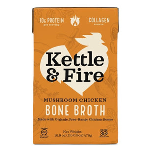 The image displays a carton of KETTLE & FIRE - MUSHROOM CHICKEN BONE BROTH. The label specifies that it includes 10g of protein per serving, is a collagen source, gluten-free, and crafted with organic mushrooms and free-range chicken bones. The carton has a net weight of 16.9 oz (1 lb 0.9 oz) or 479g.