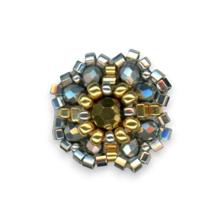 The MIGUEL ASES - BEADED MIYUKI STUD EARRINGS from MIGUEL ASES, INC. are intricately designed, featuring circular patterns and a central 14K gold-fill gem. Handcrafted in America, these earrings are adorned with metallic and small square beads in varying shades that form a beautiful floral-like structure.