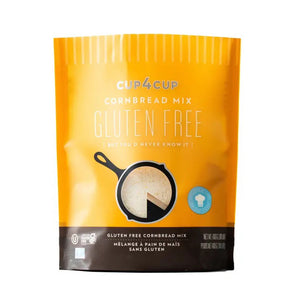 The bright yellow-orange bag, labeled "CUP4CUP GLUTEN FREE CORNBREAD," showcases an image of cornbread in a skillet with a slice cut out. This non-GMO mix, confirmed to be gluten free below the title, displays weight details: "Net Wt. 1lb (453.6g).