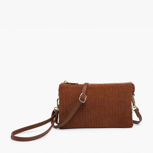 The CORDUROY WRISTLET CROSSBODY by JEN & CO, ideal for your fall wardrobe, is a brown corduroy bag featuring a detachable shoulder strap and gold hardware. It offers a convenient zipper closure against a plain white backdrop.